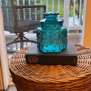 Used green glass decorative jar